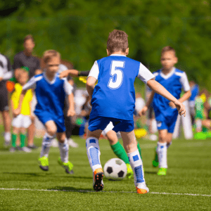 Kids playing football on 3g